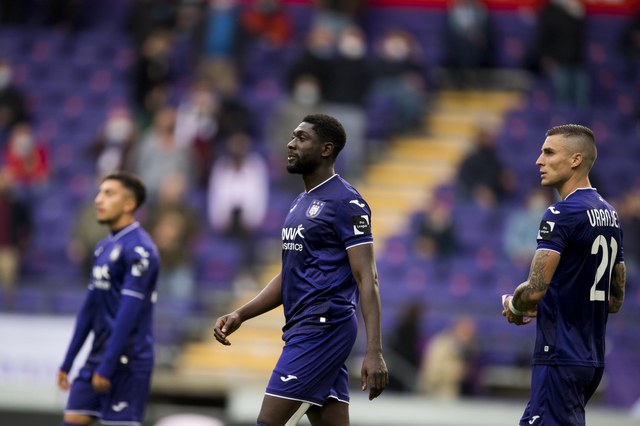 Club's Percy Tau and Anderlecht's Derrick Luckassen fight for the