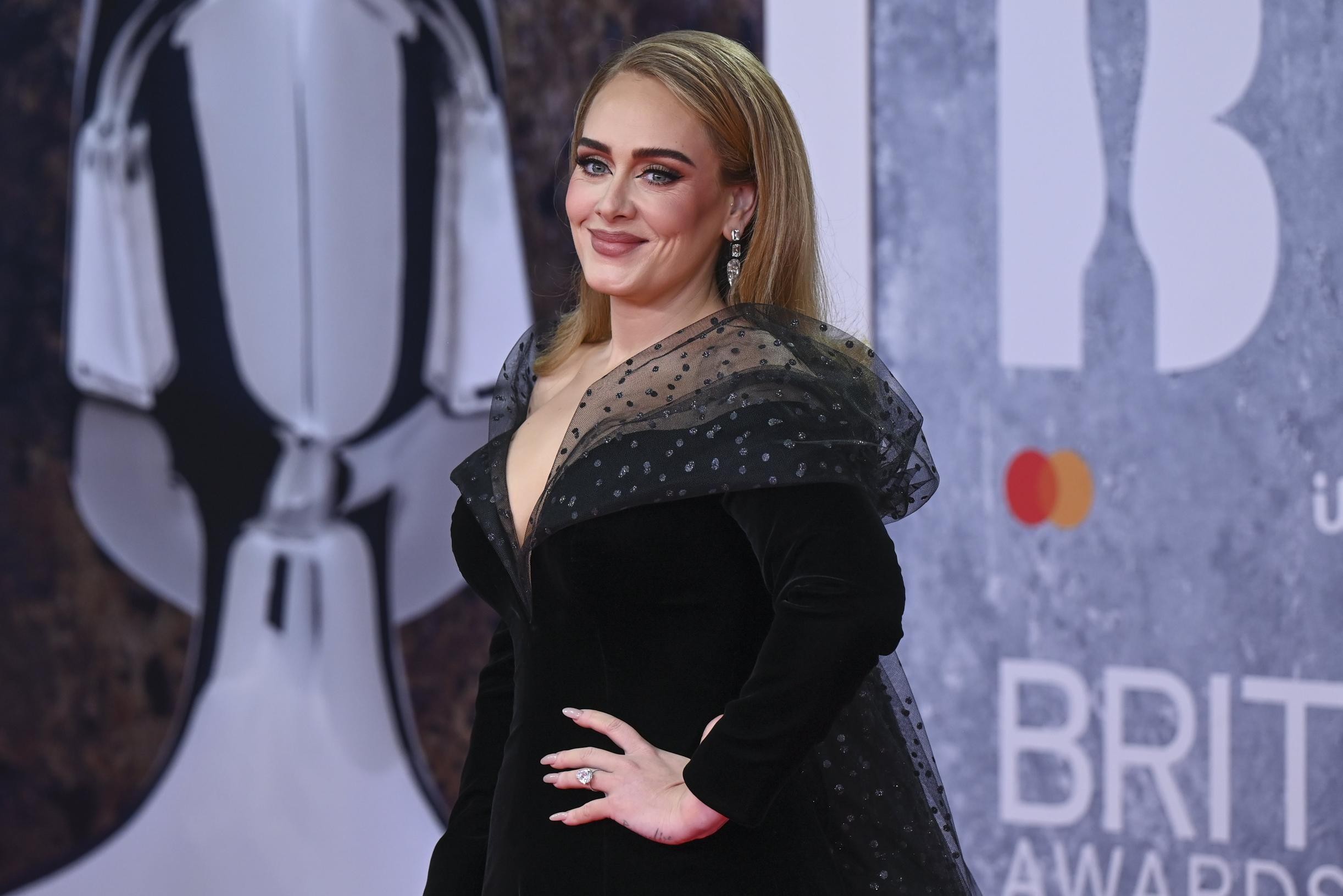 Adele quells rumors of breakup with unseen images