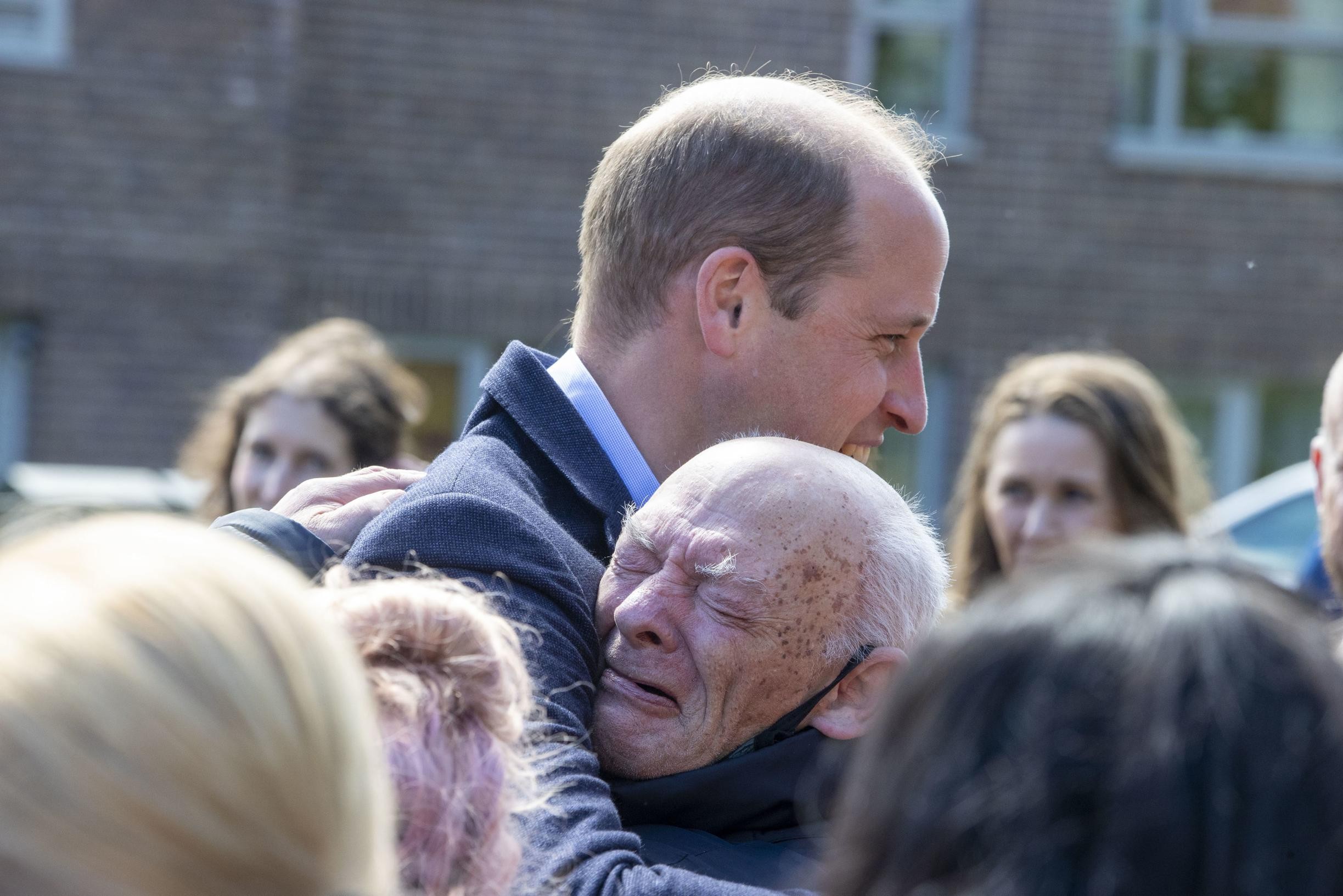 After his mother?  Prince William throws protocol overboard and hands out big hug to emotional old man