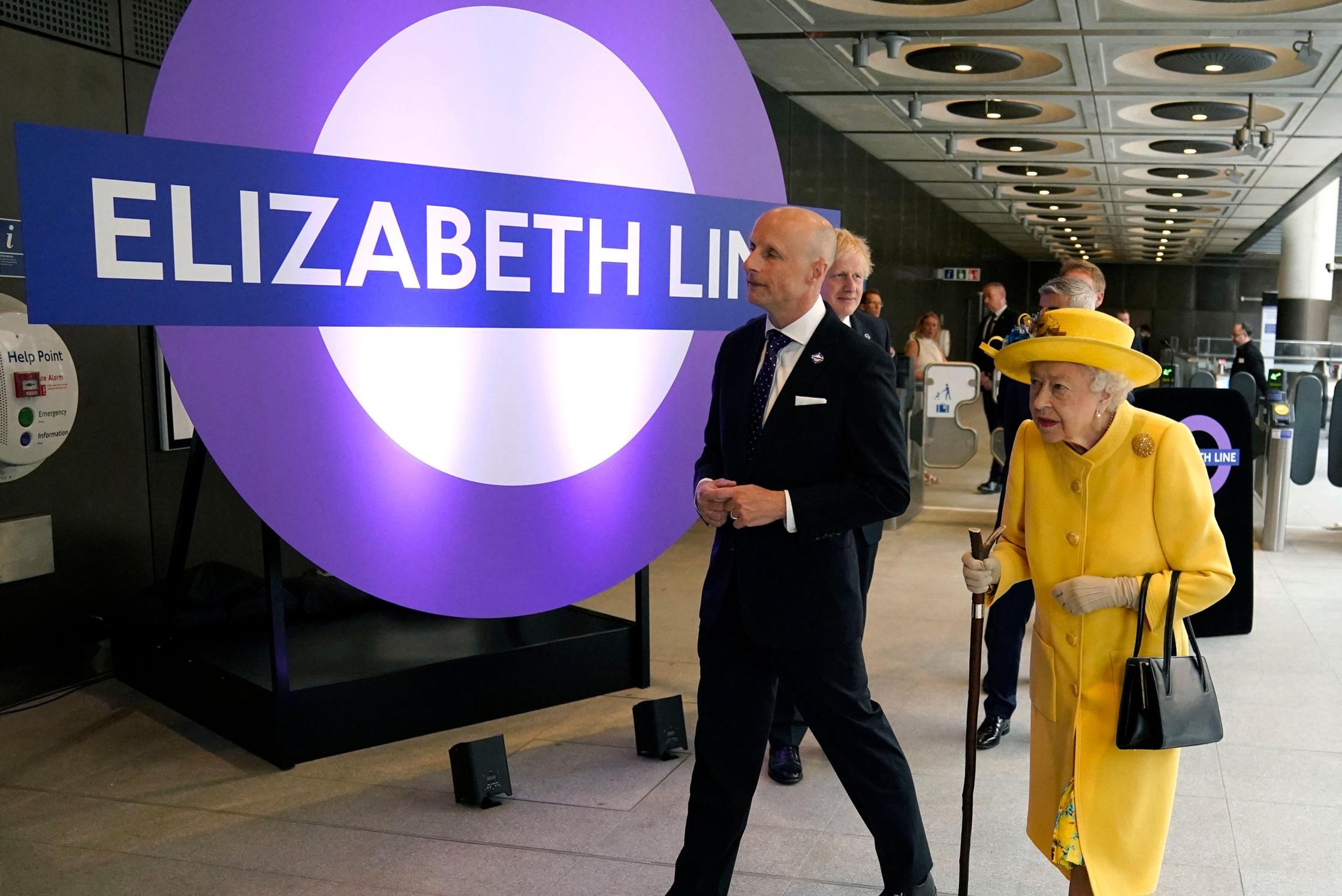 Queen Elizabeth makes surprise visit to renovated subway station in sunny yellow outfit