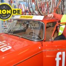 Lucien De Schepper in het museum van het Centrum Ronde van Vlaanderen bij de Flandria-ploegwagen van onder andere Briek Schotte, een Peugeot 404 van het bouwjaar 1952.