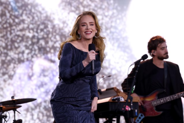 Adele confirms that she is getting married and shows off the ring at a ceremony in Munich